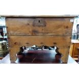 Early 19th Century pine small five plank coffer, with shaped apron, raised on shaped legs, the crude