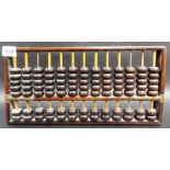 A Chinese hardwood brass bound abacus