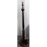 Mahogany turned and fluted standard lamp.