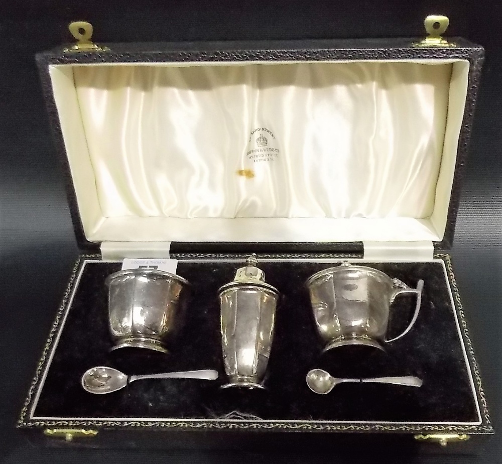 Cased three piece cruet by Mappin & Webb of octagonal pedestal form comprising pepper shaker,