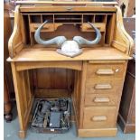 Early 20th Century oak Harris Lebus roll top desk, the tambour front with fitted interior over a