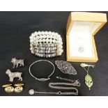 Tin of costume jewellery inc. a silver filigree amethyst brooch etc