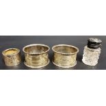Pair of Victorian foliate engraved napkin rings, Chester 1901; together with a small silver lidded