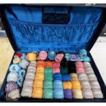 Quantity of rolls of crochet thread within a suitcase