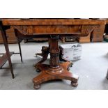 William IV mahogany games table, the hinged rectangular top with baize inset over the scroll