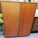 Retro teak folding cube desk cabinet, the hinged doors revealing a fitted interior with writing