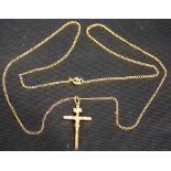 9ct gold crucifix on yellow metal chain, eight overall 2.6g approx.