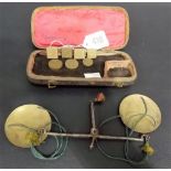 Cased set of 19th Century coin scales, the steel scales with two brass circular trays and with