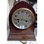 Two train mantel clock with mahogany inlaid lancet case, the silvered dial with Arabic numerals, the