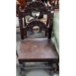 Antique Caroleon style chair with a shaped carved top and mid rail, scroll carved and with a bearded