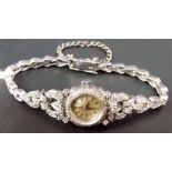 Good 18ct white gold diamond set Omega manual wind ladies cocktail wrist watch, the silvered dial