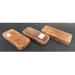 3 Antique leather covered rectangular map or paper weights, one by J. Halden & Co Ltd, Manchester