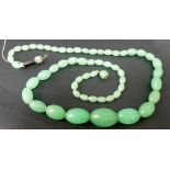 Green Jade graduated oval bead necklace, the beads graduate from approximately 7mm to the largest
