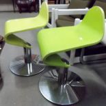 Pair of green painted bent ply low stools upon chrome pedestal base.