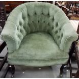 Victorian button back upholstered tub chair with cabriole legs and brass castors.