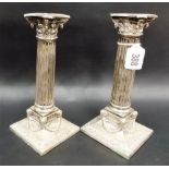 Pair of silver plate corinthian column candle sticks, height 8'.