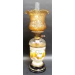 Pottery & glass oil lamp with dimpled amber flared shade, the pottery body printed & painted with