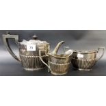 Edwardian silver 3-piece bachelor tea set, of oval half fluted form, maker R.P, London 1906,