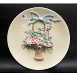 Clarice Cliff Newport Pottery relief moulded circular wall plaque moulded with a basket of