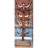Unusual Victorian oak coat stand applied with five pairs of horns, the base with metal drip tray,