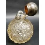 Edwardian silver lid hobnail cut glass perfume bottle, the ovoid hinged lid revealing a stopper,