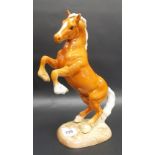 Beswick Pottery model of a rearing palomino horse No. 1014 (small chip to ear)