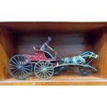 A Victorian style cast iron toy, a cart & horse with figure, the cart cast with the word 'CHIEF.'