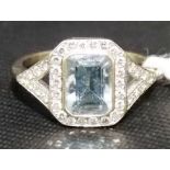 Attractive Art Deco white gold aquamarine and diamond cluster ring, the emerald cut aquamarine 8mm x