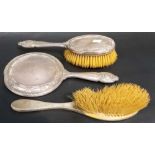 Edwardian silver dressing table hairbrush and hand mirror, Birmingham 1907; together with another