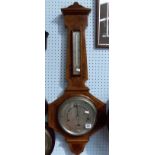 1940's walnut inlaid aneroid barometer/thermometer with silvered dial within a shaped case, height