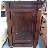 George III oak inlaid corner cupboard, the door with cross banding and shell inlay revealing three