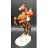 Beswick Pottery model of a red jacket huntsman upon rearing horse, No. 868