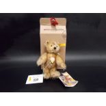 Modern Steiff miniature bear 'Petsy' within box.