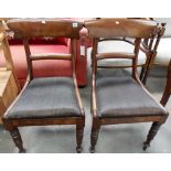 Set of six William IV mahogany dining chairs with plain back and mid rail over a drop in upholstered