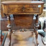 Victorian burr walnut veneered worktable, the top with inverted corners hinged to reveal a blue gilt