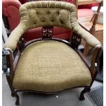 Victorian walnut framed tub armchair with three carved and pierced back rails upon cabriole legs.