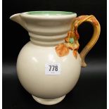 Clarice Cliff Newport Pottery relief moulded jug, the handle moulded with entwined branches & a
