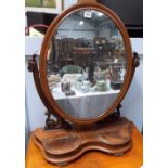 Victorian mahogany oval swing toilet mirror with shaped base and two oval shaped hinged
