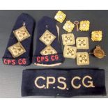 Five gilt metal military badges; together with a civilian guard WAC badge, two material shoulder
