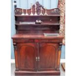 Victorian mahogany chiffonier, the raised back foliate scroll carved and with two open shelves,