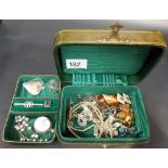 A green leather gilt tooled small jewellery box; together with various costume jewellery inc.