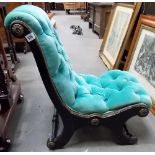 Victorian ebonised nursing chair with green velvet button back upholstery.