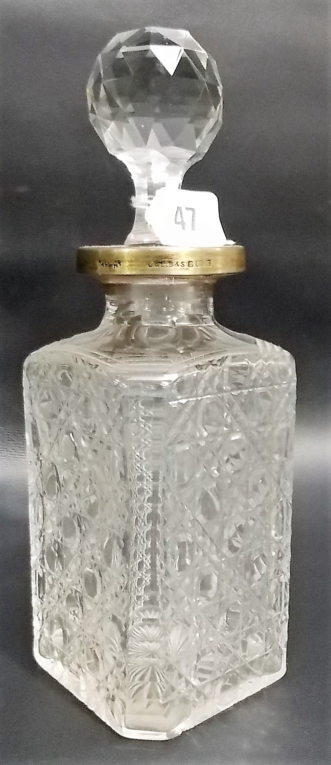 Edwardian silver rim cut glass whisky decanter and stopper, the silver rim with patent locking