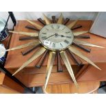 Metamec quartz brass and teak sunburst wall clock.