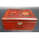 Chinese lacquer hinged rectangular tea caddy, the lid painted with a bird amongst flowers and with a