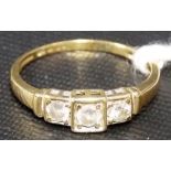 9k gold three stone diamond ring, each stone of 0.10ct spread approx. within a square setting,