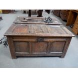 18th Century oak coffer of panelled construction, the hinged lid over the three panelled front