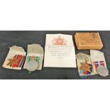 Set of four WWII British medals including the Defence Medal, War Medal 1939-1945, Star and Burma