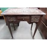 Georgian oak low boy, the later carved top over three small carved drawers and raised on straight