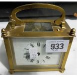 Brass carriage timepiece of rectangular section, the white enamel dial with Roman numerals, French